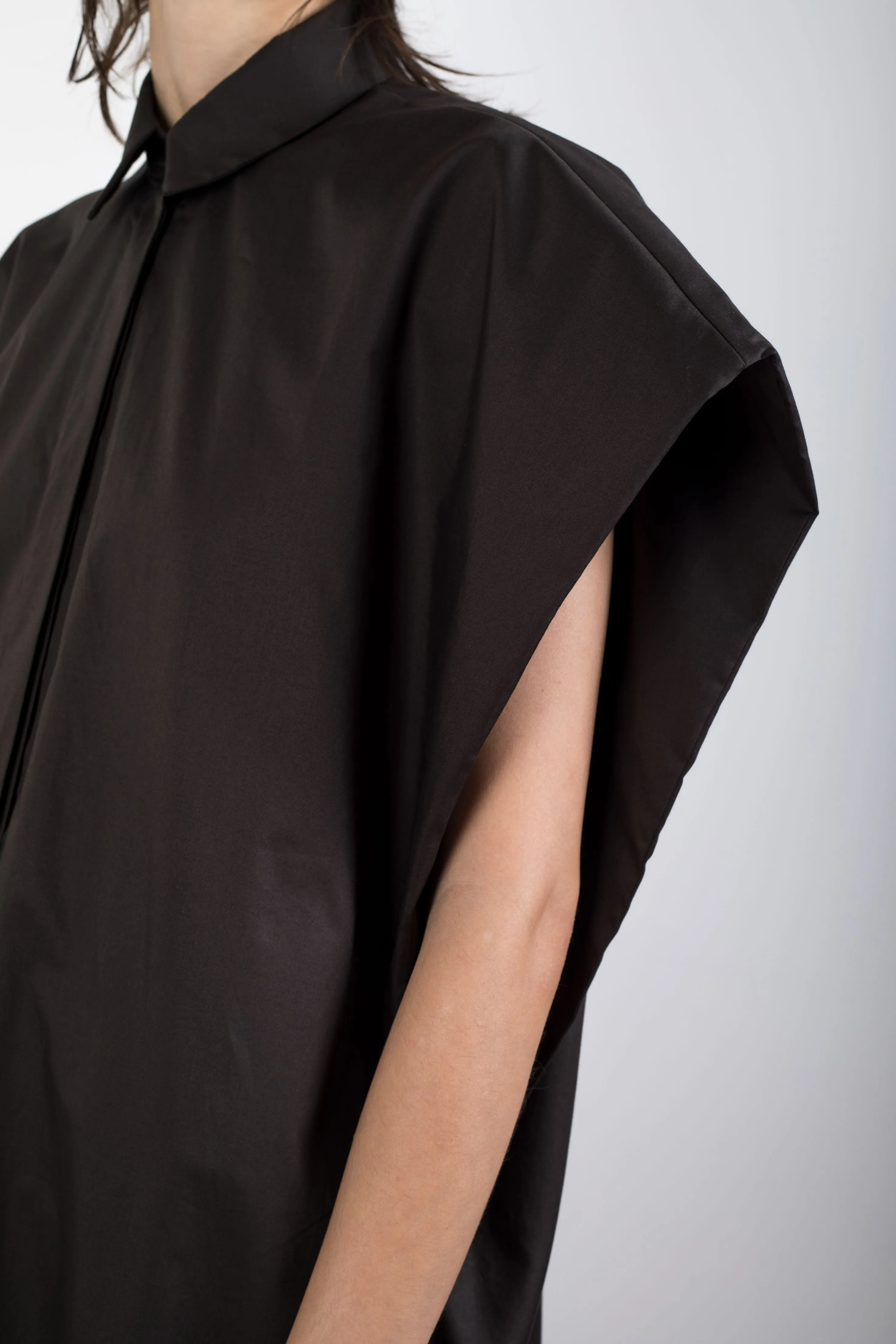 Black elongated sleeveless shirt